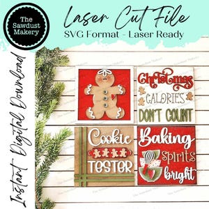 May include: Three wooden signs with Christmas-themed designs. The first sign features a gingerbread man, the second sign says "Christmas Calories Don't Count", and the third sign says "Cookie Baking Spirits Bright".