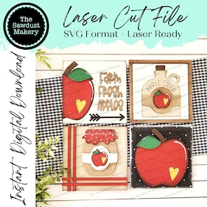 Op de afbeelding: Vier lasergesneden SVG-bestanden voor een herfst-knutselproject. De bestanden bevatten een rode appel met een groen blad, een pot appelboter, een fles appelsap en een bord met de tekst "Farm Fresh Apples".