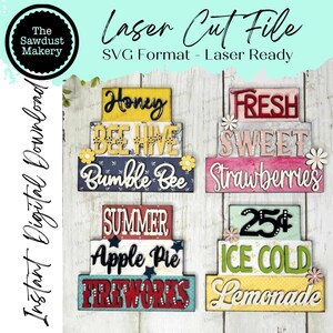 May include: Four sets of stacked wooden signs with summer-themed text. The signs are decorated with various colors, patterns, and embellishments. The text on the signs reads: "Honey, Bee Hive, Bumble Bee", "Fresh, Sweet, Strawberries", "Summer, Apple Pie, Fireworks", and "25¢, Ice Cold, Lemonade".