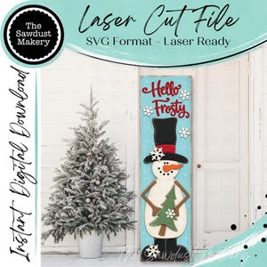May include: A vertical rectangular sign featuring a snowman illustration with a black top hat, orange carrot nose, and a green tree. The sign has a light blue background with white snowflakes and the red text Hello Frosty. Laser Cut File SVG Format.