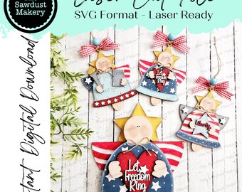 May include: Four laser cut wooden angel ornaments with a patriotic theme. Each angel has a red, white, and blue color scheme with stars and stripes. The angels have different sayings on them, including "Let Freedom Ring", "Liberty", and "1776".