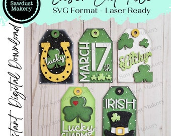 May include: Five laser cut SVG files for St. Patrick's Day. The files include a horseshoe with a shamrock, a shamrock with a heart, a shamrock with the word "lucky", a tag with the text "March 17th", and a tag with the text "Irish" and a leprechaun hat.