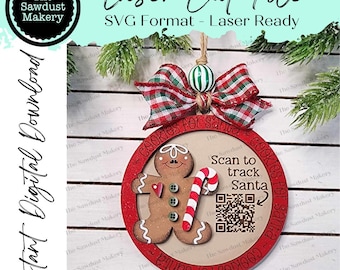 May include: A red and white gingerbread man ornament with a QR code that says "Scan to track Santa". The ornament is decorated with the words "Cookies for Santa" on both sides.