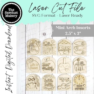 May include: Laser cut file of mini arch inserts, each measuring approximately 6.35cm x 7.62cm. The inserts are made of light-colored wood and feature various designs and phrases, including a snowman, the word "LOVE", and "Hello Fall".