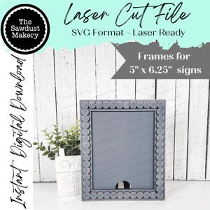 May include: A gray laser cut frame with a beaded border, designed for 5 inch by 6.25 inch signs. The frame is shown on a white wood background.