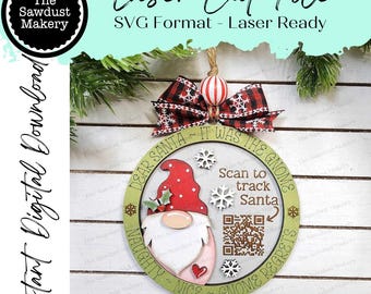 May include: A laser cut file for a Christmas gnome ornament. The ornament is a circle with the text "Dear Santa It Was The Gnome Naughty ~ Nice ~ Gnome Regrets" around the edge. In the center is a gnome with a red hat and a white beard. There is a QR code with the text "Scan to track Santa".