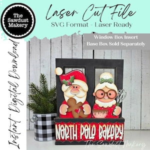 May include: A laser cut file digital download for a North Pole Bakery window box insert. The design features Santa Claus holding a gingerbread man and a character with glasses holding a whisk, set against a black frame with red base text.