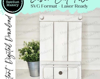 May include: White wooden shelf with a drawer and two compartments. The shelf has a distressed white paint finish and is ready to be laser cut.