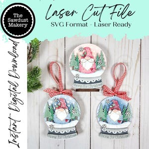 May include: Three wooden Christmas ornaments shaped like snow globes, each featuring a gnome with a red hat and white beard. The ornaments have a red and white ribbon for hanging. Text on the ornaments reads "Gnome for Christmas". The image also includes the text "Laser Cut File".