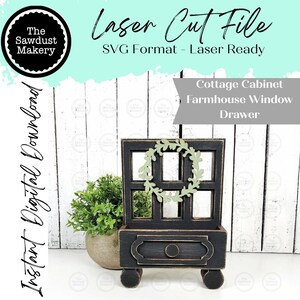 May include: A black wooden cottage cabinet with a farmhouse window design, featuring a drawer and a decorative wreath. The text "Laser Cut File" and "Instant Digital Download" are visible. The cabinet is a laser-ready SVG format.
