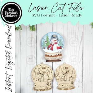 May include: A laser-cut file for a snowman snow globe ornament. The image shows a finished snow globe with a snowman, trees, and the words "Warm Winter Wishes." Two unfinished ornaments are also shown.