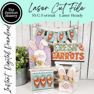 May include: A collection of laser-cut wooden Easter decorations. Includes a bunny-shaped cutting board, a sign that says "Fresh Carrots", a banner with carrots, and a bunny-shaped block. The decorations are painted in pastel colors with floral accents.