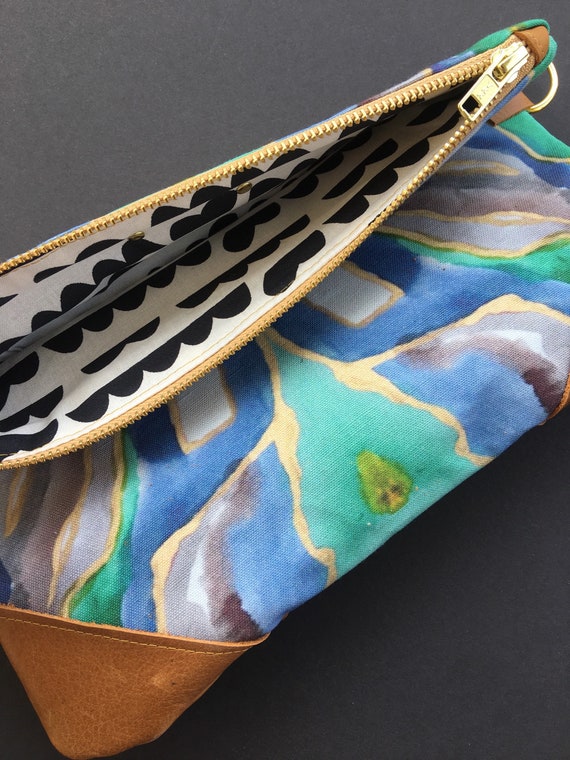 Blue and green clutch bag deals