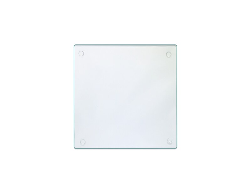May include: A clear glass cutting board with rounded corners and four small holes.