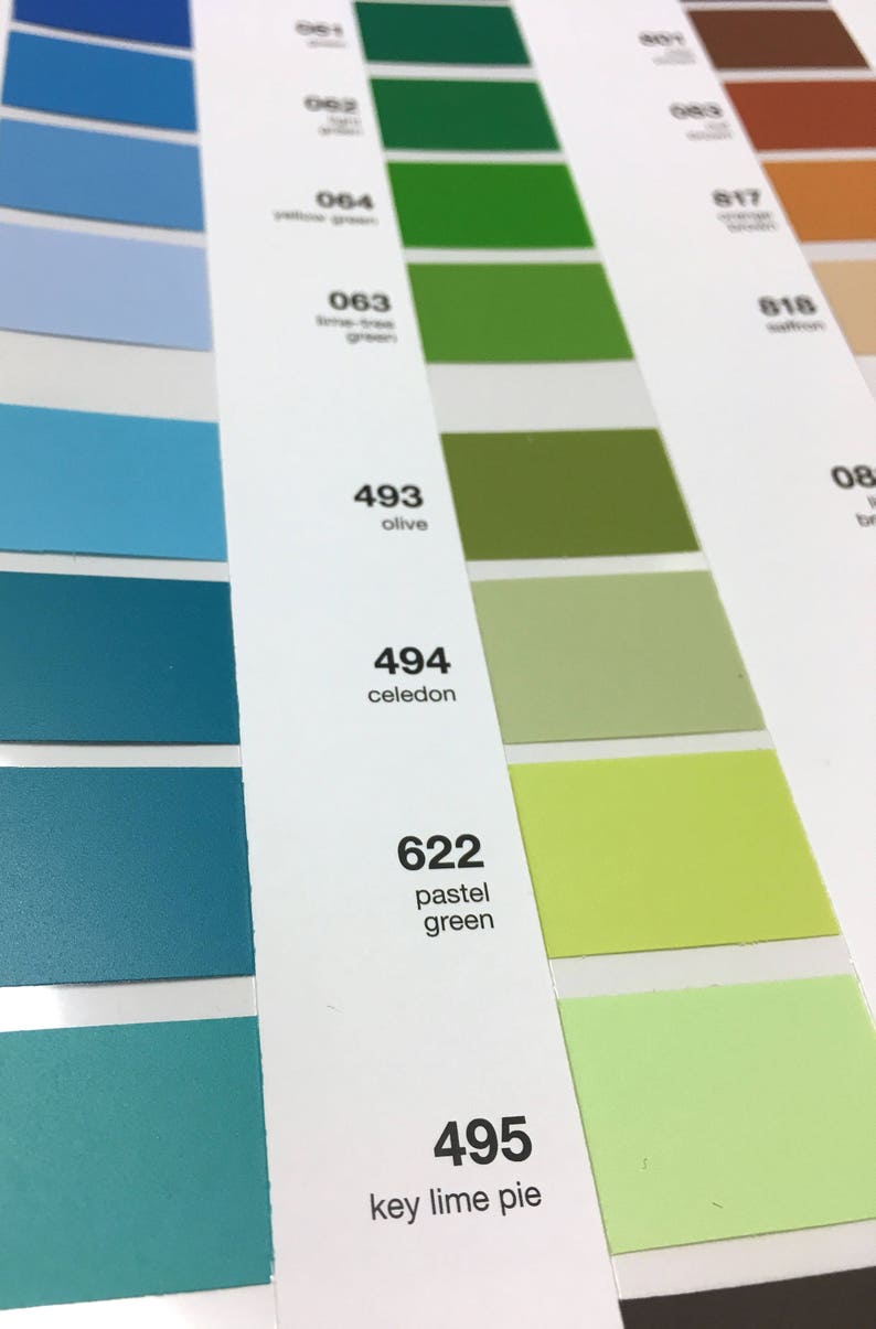 May include: Color chart featuring a range of green and blue hues, with names and numbers printed alongside each color swatch. Shades include olive, celadon, and key lime pie. The chart is for design or reference.