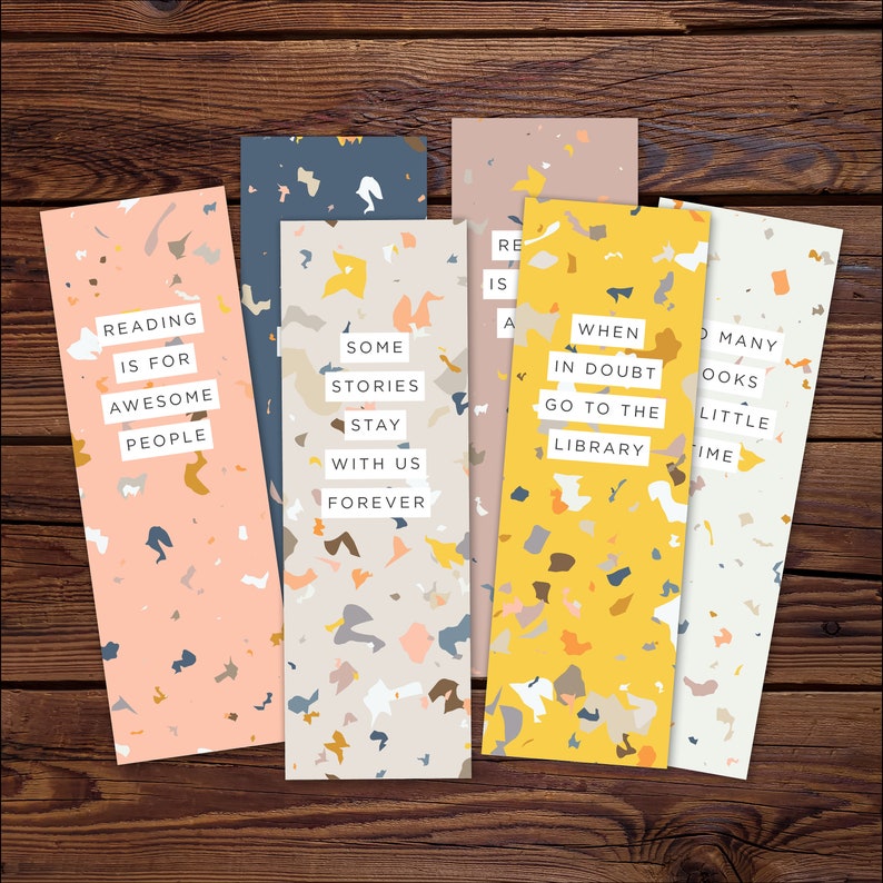 May include: Set of five colorful bookmarks with terrazzo patterns and inspirational quotes about reading. The quotes are: "Reading is for awesome people", "Some stories stay with us forever", "When in doubt go to the library", "Reading is a superpower", and "So many books so little time".