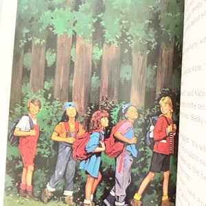 May include: A book illustration depicting five children walking in a line through a dense forest. Each child wears casual clothing, including shirts, shorts, or overalls, and carries a backpack. The scene features tall trees and green foliage.