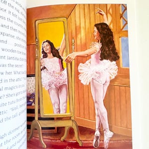 May include: A book illustration depicting a dancer with long dark hair wearing a pink leotard and tutu, standing before a tall, gold-framed floor mirror. The dancer is reflected in the mirror, which is positioned on a red rug in a wood-paneled room.