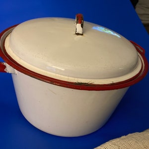 Beautiful Dutch Oven enamel white with red trim.