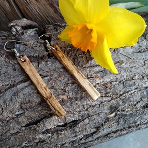 Unique, handcrafted, oak earrings with sterling silver wires.  Adds beauty and interest to your collection.