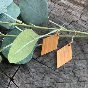 Unique, handcrafted, oak wood earrings with sterling silver wires.  Adds beauty and interest to your collection.