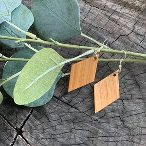 Unique, handcrafted, cherry wood earrings with sterling silver wires.  Adds beauty and interest to your collection.
