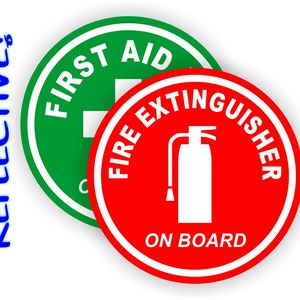 May include: Two round, reflective safety stickers. The first sticker is green with white text that reads "FIRST AID" and a white cross. The second sticker is red with white text that reads "FIRE EXTINGUISHER ON BOARD" and a white silhouette of a fire extinguisher.