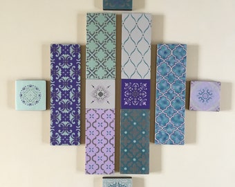 Wall art painted in shades of turquoise,grey and purple
