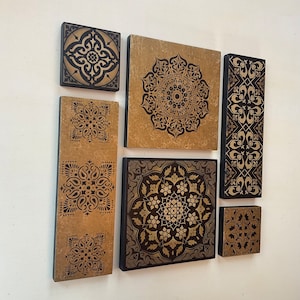 Unique wall art painted in black and antique gold