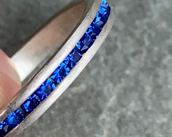 Sterling Silver Channel Set Blue Crystals Eternity Band, size 8 1/4