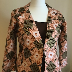 Contemporary look in African print jacket has 3/4 sleeves It can be customised to any size and sleeves