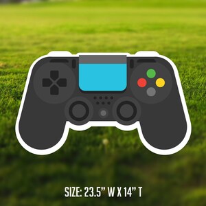 May include: Black and white sticker of a video game controller with blue, red, green, and yellow buttons. The sticker is 23.5 inches wide and 14 inches tall.  SIZE: 23.5" W X 14" T