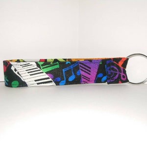New Key Fob / Wrist Lanyard / Wristlet / Key Chain / Fabric Strap / Multicolored with Music Notes Piano Keys Badge Card
