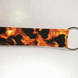 Nuevo llavero/cordón de muñeca/pulsera/llavero/correa de tela/tarjeta de insignia de llamas de fuego