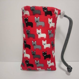 May include: Red drawstring bag with a pattern of white, gray, and black French Bulldogs. The bag has a gray drawstring.