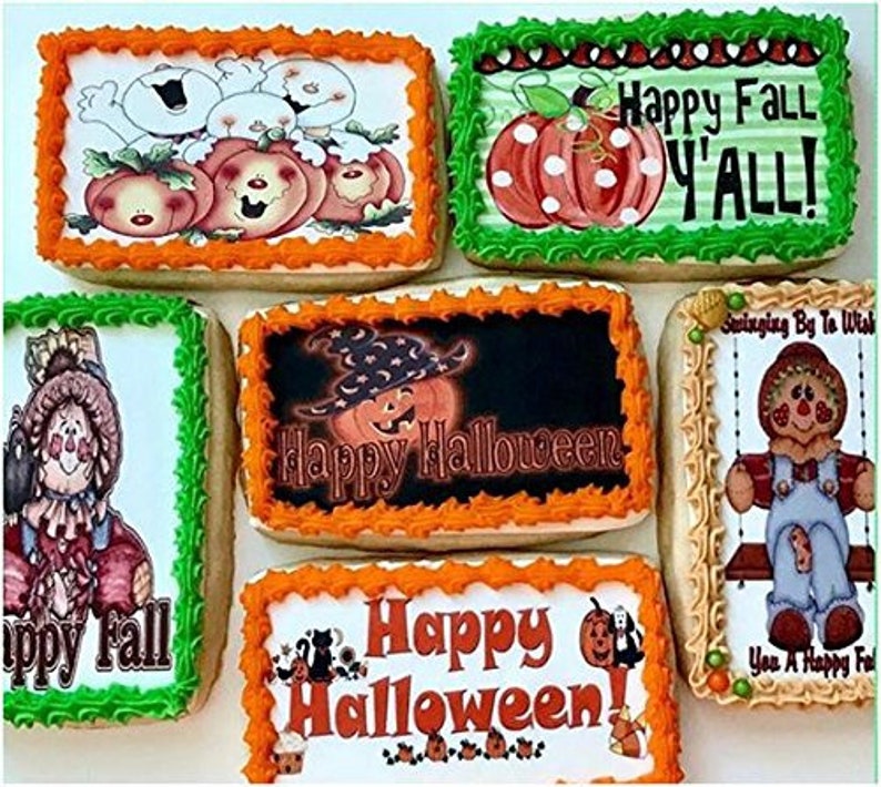 May include: A collection of decorated Halloween and fall-themed cookies. The cookies feature images of pumpkins, scarecrows, and the text "Happy Halloween" and "Happy Fall Y'all!" The cookies have orange, green, and tan frosting.