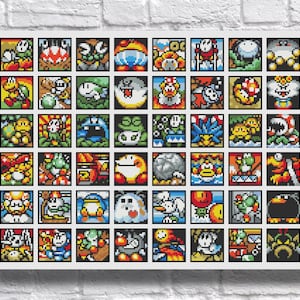 以下が含まれることがあります： カメ、幽霊、植物など、カラフルなピクセル化されたビデオゲームのキャラクターや生き物を描いた42個の正方形のアイコンが、6行7列のグリッド状に並べられたクロスステッチのパターン。