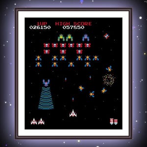 May include: Framed print of a classic arcade game with pixelated spaceships and alien invaders. The game screen displays the score and a vibrant space battle scene. The artwork is set against a starry background.