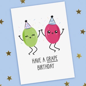 A funny birthday card with a hand drawn image of grapes, one red wearing a blue party hat with pale blue stripes and the other green wearing a blue party hat with pink spots. They are throwing confetti. The card caption is: Have A Grape Birthday.