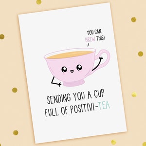 A funny good luck card with a hand drawn image of a pink cup of tea. The cup has a speech bubble saying you can brew this. The card caption is: Sending You A Cup Full Of Positive-Tea