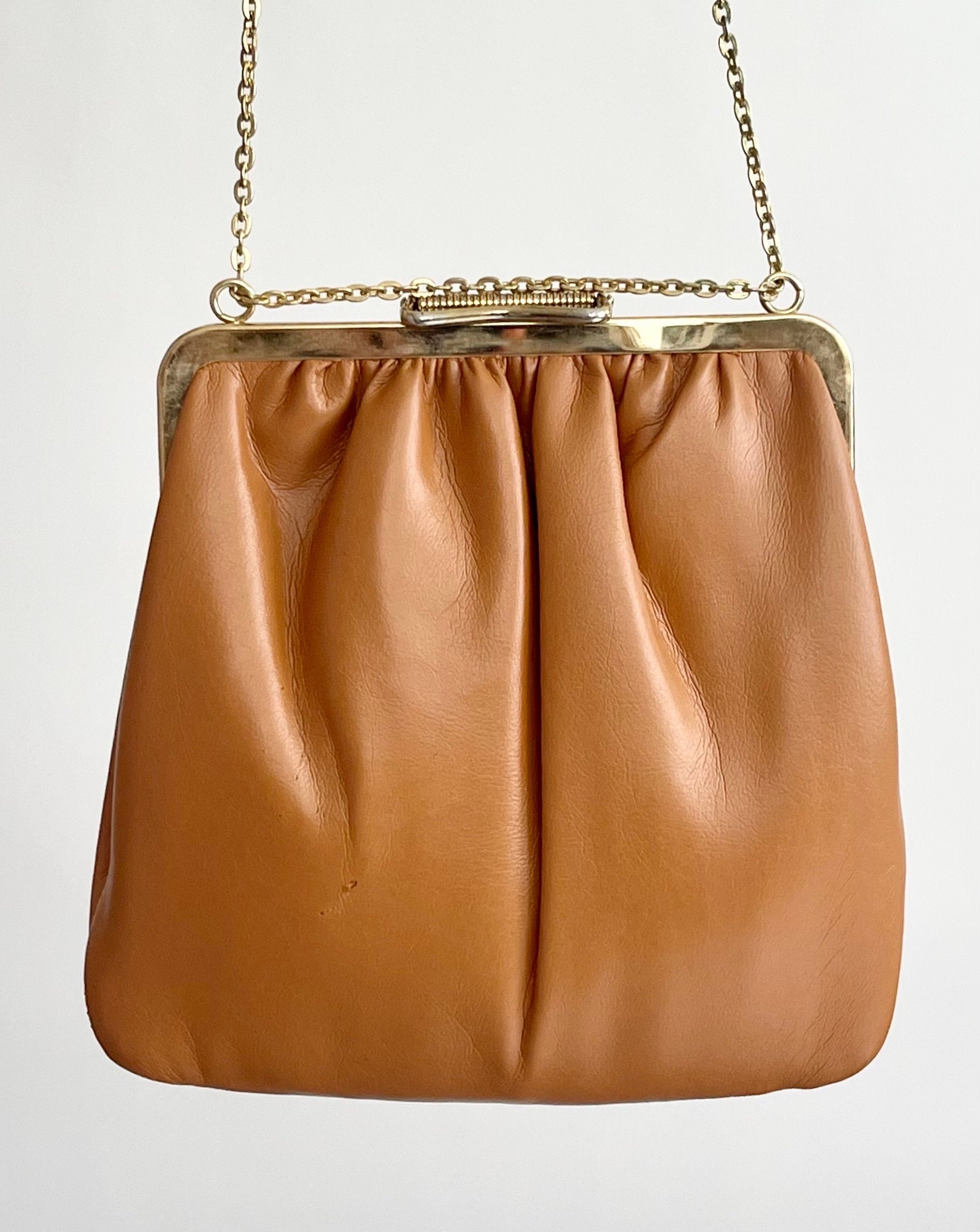 white purse with gold chain