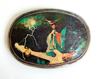 Fibbia per cintura vintage Pacifica Jimi Hendrix del 1976, cimelio rock da collezione.