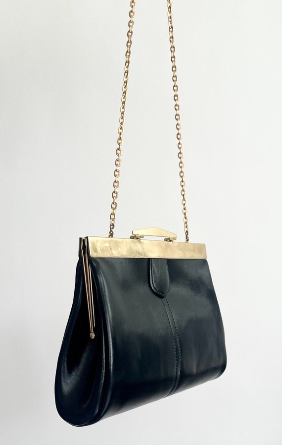 Minimalist Black Leather Bag Convertible Clutch Mid Century Simple Clean Style Gold Frame and Chain Link Strap