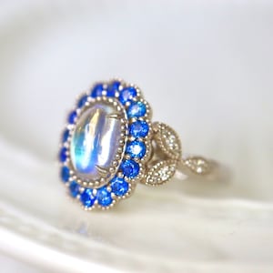 Mesmerizing Blue Moonstone Halo Ring. Moonstone engagement ring. Blue sapphires & diamonds. Edwardian Moonstone. 14K White Gold. US 7.25RTS