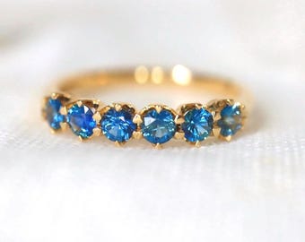 Teal Blue Sapphire Eternity Band in 14Kt Yellow Gold Sapphire Minimal Intense Blue Sapphire with precision cut sapphires Size7