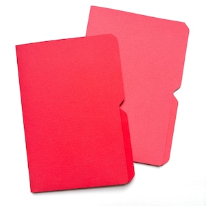 May include: Two red file folders with a textured surface are displayed against a white background. One folder is slightly darker than the other. The folders have a pocket on the bottom and a curved top.