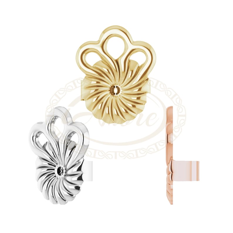 May include: Three earring backs in different colors: gold, silver, and rose gold. Each back features a decorative design with a swirl pattern and a small hole in the center.