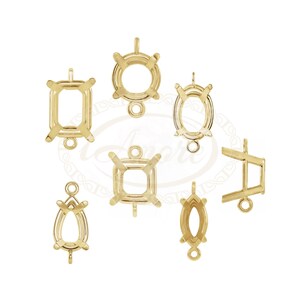 May include: Assortment of gold-tone metal settings for bezel setting gemstones. The settings are in various shapes, including round, oval, square, pear, and marquise.