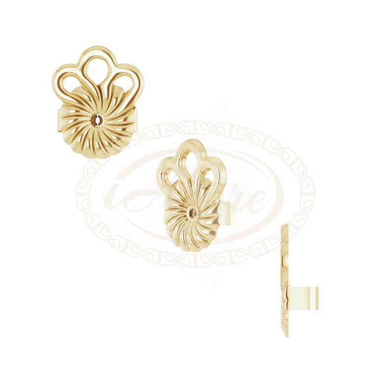 May include: A pair of gold-tone earrings with a floral design. The earrings are made of metal and have a shiny finish.
