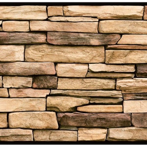 May include: A close-up of a stone wall with a variety of brown, tan, and reddish-brown stones. The stones are arranged in a random pattern, creating a rustic and natural look.